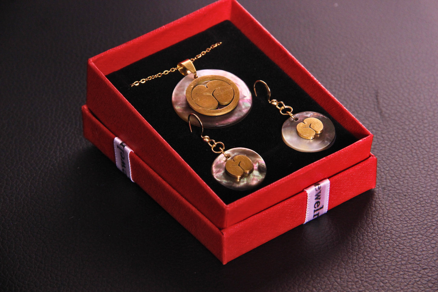 Coco de Mer on Black shell drop down earrings